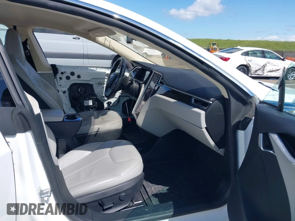 2014 Tesla Model S 60 with VIN 5YJSA1H10EFP56526, listed as a IAAI auction lot 41871784 with 143,361 mi miles and . Bid and sale history available at DreamBid. Image 5.