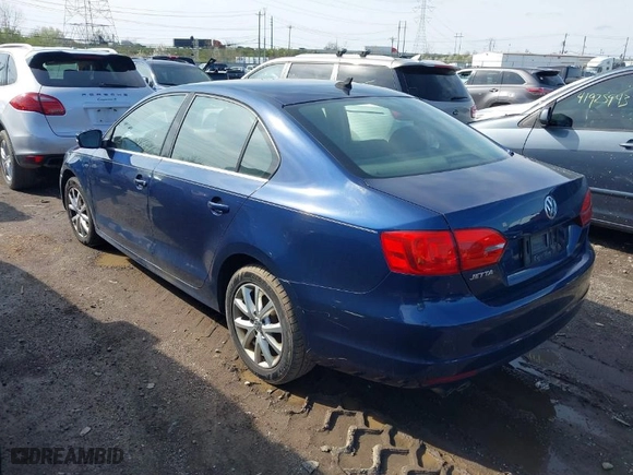 2014 Volkswagen Jetta Sedan SE with VIN 3VWD17AJ9EM303584, listed as a IAAI auction lot 41944386 with 130,921 mi miles. Bid and sale history available at carsss.com. Image 3.