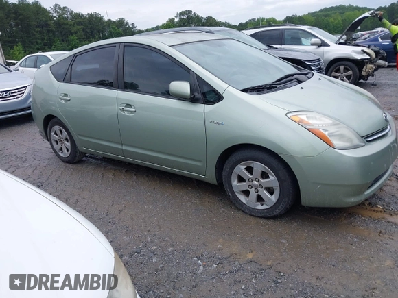 2007 Toyota Prius z VIN JTDKB20U077602951, wystawiony jako IAAI lot #42384098 z przebiegiem 169 136 mil mil oraz . Historia ofert i sprzedaży dostępna na DreamBid. Obrazek 1.