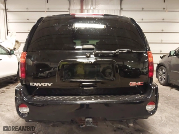 2004 GMC Envoy SLE with VIN 1GKDT13S542265104, listed as a IAAI auction lot 41884797 with 154,190 mi miles. Bid and sale history available at carsss.com. Image 17.