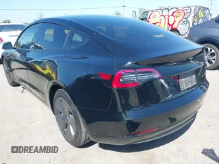 2021 Tesla Model 3 Long Range with VIN 5YJ3E1EB2MF065583, listed as a IAAI auction lot 42067399 with 52,333 mi miles. Bid and sale history available at carsss.com. Image 3.