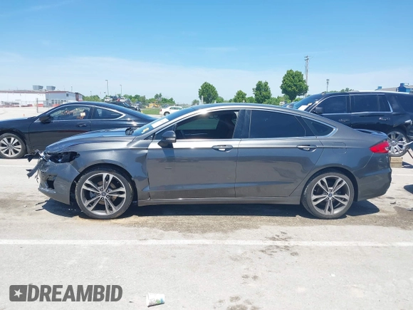 2020 Ford Fusion Titanium with VIN 3FA6P0K96LR173971, listed as a IAAI auction lot 42232469 with 82,474 mi miles and . Bid and sale history available at DreamBid. Image 15.