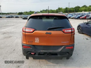 2015 Jeep Cherokee Trailhawk with VIN 1C4PJMBS0FW675807, listed as a Copart auction lot 58800615 with 109,019 mi miles and Salvage title. Bid and sale history available at DreamBid. Image 6.