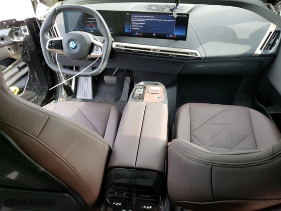 2023 BMW iX M60 with VIN WB533CF03PCM65597, listed as a Copart auction lot 69608884 with 4,793 mi miles and Salvage Title. Bid and sale history available at carsss.com. Image 8.