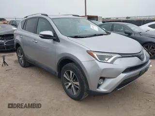 2018 Toyota RAV4 XLE z VIN 2T3WFREV0JW409842, wystawiony jako IAAI lot #42057521 z przebiegiem 145 915 mil mil oraz . Historia ofert i sprzedaży dostępna na DreamBid. Obrazek 1.