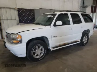 2003 GMC Yukon Denali z VIN 1GKEK63U23J136487, wystawiony jako Copart lot #57974035 z przebiegiem 280 637 mil mil oraz Tytuł czysty. Historia ofert i sprzedaży dostępna na DreamBid. Obrazek 1.