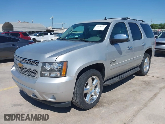 2013 Chevrolet Tahoe LT with VIN 1GNSCBE07DR164486, listed as a IAAI auction lot 42216421 with 220,395 mi miles and . Bid and sale history available at DreamBid. Image 2.