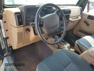 2000 Jeep Wrangler Sahara with VIN 1J4FA59S2YP750795, listed as a Copart auction lot 52353503 with 0 mi miles and Salvage Title. Bid and sale history available at carsss.com. Image 8.