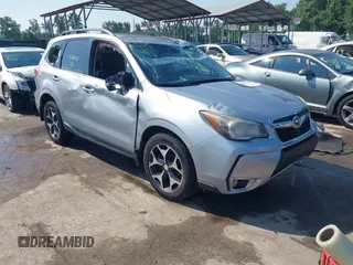 2014 Subaru Forester XT Touring z VIN JF2SJGMC1EH405278, wystawiony jako IAAI lot #42680411 z przebiegiem 38 345 mil mil oraz . Historia ofert i sprzedaży dostępna na DreamBid. Obrazek 1.