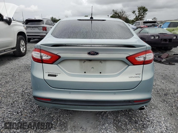 2013 Ford Fusion SE Hybrid z VIN 3FA6P0LU6DR174719, wystawiony jako Copart lot #62877715 z przebiegiem 52 884 mil mil oraz Szkoda całkowita • Salvage title. Historia ofert i sprzedaży dostępna na DreamBid. Obrazek 6.