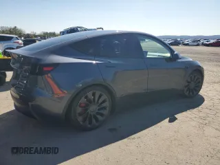 2023 Tesla Model Y Performance z VIN 7SAYGDEF9PF865129, wystawiony jako Copart lot #50228735 z przebiegiem Nie podano mil oraz Szkoda całkowita • Salvage title. Historia ofert i sprzedaży dostępna na DreamBid. Obrazek 3.