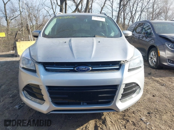 2015 Ford Escape Titanium z VIN 1FMCU0J91FUC41531, wystawiony jako IAAI lot #41903203 z przebiegiem 118 962 mil mil oraz . Historia ofert i sprzedaży dostępna na DreamBid. Obrazek 12.