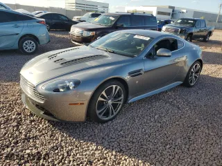 2011 Aston Martin V12 Vantage Carbon Black with VIN SCFEBBCF4BGS00791, listed as a Copart auction lot 76911374 with 8,207 mi miles and Salvage Title. Bid and sale history available at carsss.com. Image 1.