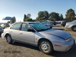 1999 Saturn SL with VIN 1G8ZK5274XZ367394, listed as a Copart auction lot 63863795 with 73,197 mi miles and Salvage title. Bid and sale history available at DreamBid. Image 4.