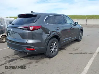 2021 Mazda CX-9 Sport with VIN JM3TCBBY7M0520437, listed as a IAAI auction lot 42022562 with 77,063 mi miles and . Bid and sale history available at DreamBid. Image 4.