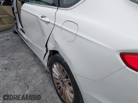 2014 Ford Fusion SE Hybrid with VIN 3FA6P0LU3ER312041, listed as a IAAI auction lot 41964588 with 138,566 mi miles and . Bid and sale history available at DreamBid. Image 6.