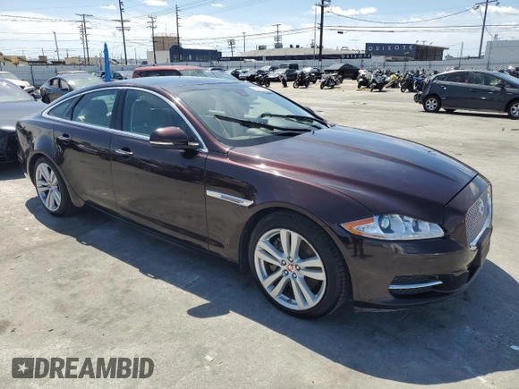 2014 Jaguar XJ with VIN SAJWA1CZ3E8V69877, listed as a Copart auction lot 51520405 with 57,567 mi miles and Clean Title. Bid and sale history available at DreamBid. Image 4.