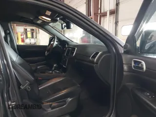 2018 Jeep Grand Cherokee Laredo E with VIN 1C4RJFAG5JC343101, listed as a IAAI auction lot 41211158 with 105,886 mi miles. Bid and sale history available at carsss.com. Image 5.