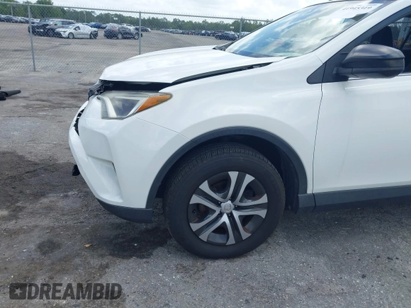 2016 Toyota RAV4 LE with VIN JTMZFREV2GJ096782, listed as a IAAI auction lot 41945319 with 76,866 mi miles. Bid and sale history available at carsss.com. Image 6.