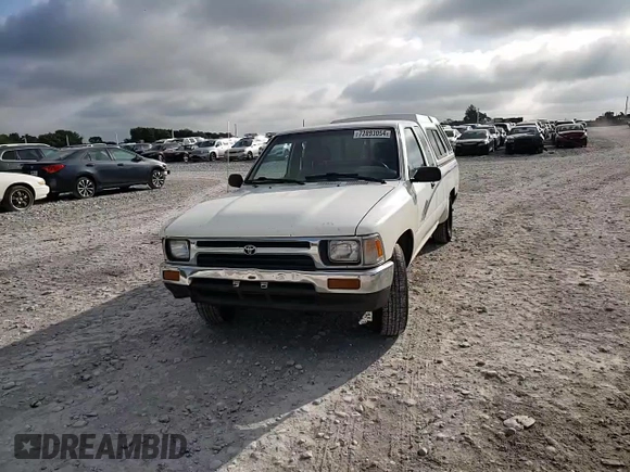 1993 Toyota Pickup DLX z VIN JT4RN93P7P5074129, wystawiony jako Copart lot #72893054 z przebiegiem 235 053 mil mil oraz Szkoda całkowita • Salvage title. Historia ofert i sprzedaży dostępna na DreamBid. Obrazek 10.