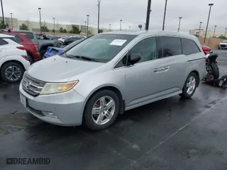 2012 Honda Odyssey Touring with VIN 5FNRL5H99CB055499, listed as a IAAI auction lot 41916534 with 278,435 mi miles. Bid and sale history available at carsss.com. Image 2.