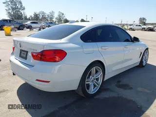 2015 BMW 4 Series 428i with VIN WBA4A9C50FGL85857, listed as a IAAI auction lot 42542619 with 136,411 mi miles and . Bid and sale history available at DreamBid. Image 4.