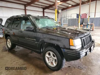 1998 Jeep Grand Cherokee Limited z VIN 1J4GZ88Z0WC276394, wystawiony jako Copart lot #46702355 z przebiegiem 144 232 mil mil oraz Szkoda całkowita • Salvage title. Historia ofert i sprzedaży dostępna na DreamBid. Obrazek 4.