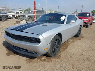 2012 Dodge Challenger SXT Plus with VIN 2C3CDYAG9CH104972, listed as a IAAI auction lot 41738042 with 148,794 mi miles. Bid and sale history available at carsss.com. Image 2.