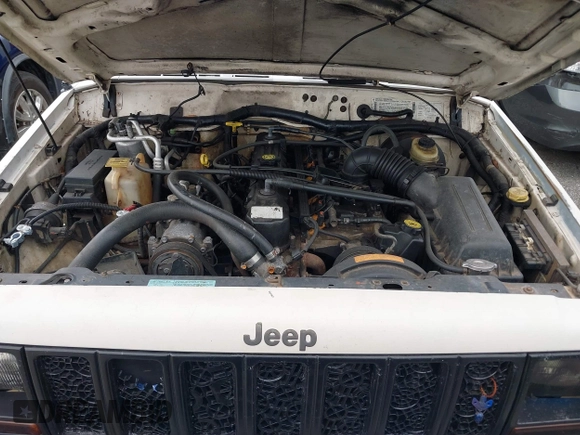 1998 Jeep Cherokee Sport with VIN 1J4FT68S5WL199283, listed as a IAAI auction lot 38377285 with 208,074 mi miles. Bid and sale history available at carsss.com. Image 10.