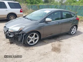 2014 Ford Focus Titanium with VIN 1FADP3N20EL422693, listed as a IAAI auction lot 42060024 with 97,371 mi miles and . Bid and sale history available at DreamBid. Image 2.