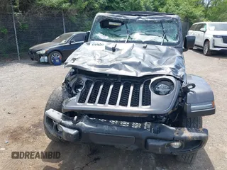 2021 Jeep Gladiator Freedom with VIN 1C6HJTAG3ML557932, listed as a IAAI auction lot 42150245 with 26,656 mi miles and . Bid and sale history available at DreamBid. Image 6.