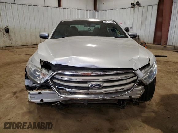 2013 Ford Taurus SEL z VIN 1FAHP2E82DG174647, wystawiony jako Copart lot #53784995 z przebiegiem Nie podano mil oraz Szkoda całkowita • Salvage title. Historia ofert i sprzedaży dostępna na DreamBid. Obrazek 5.