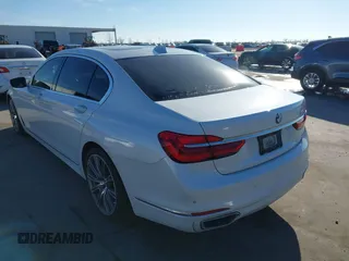 2018 BMW 7 Series 750i with VIN WBA7F0C57JGM23667, listed as a IAAI auction lot 41581035 with 113,140 mi miles and . Bid and sale history available at DreamBid. Image 3.