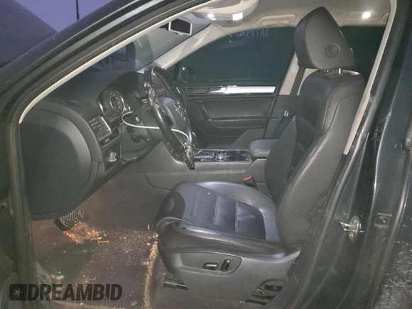 2016 Volkswagen Touareg Sport with VIN WVGEF9BP2GD005296, listed as a Copart auction lot 88808735 with 133,429 mi miles and Salvage Title. Bid and sale history available at DreamBid. Image 7.