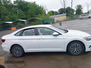 2021 Volkswagen Jetta S z VIN 3VWC57BU9MM103778, wystawiony jako IAAI lot #42493041 z przebiegiem 74 723 mil mil oraz . Historia ofert i sprzedaży dostępna na DreamBid. Obrazek 13.