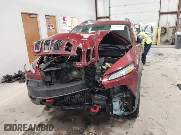 2015 Jeep Cherokee Trailhawk with VIN 1C4PJMBS7FW646577, listed as a IAAI auction lot 41404911 with 85,343 mi miles and . Bid and sale history available at DreamBid. Image 12.