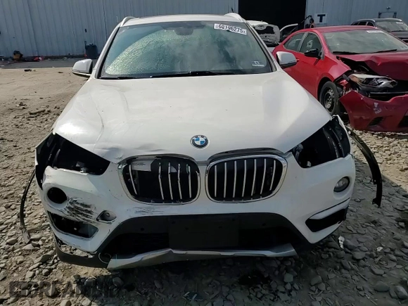 2017 BMW X1 xDrive28i z VIN WBXHT3C35H5F86099, wystawiony jako Copart lot #60196275 z przebiegiem 61 117 mil mil oraz Szkoda całkowita • Salvage title. Historia ofert i sprzedaży dostępna na DreamBid. Obrazek 14.