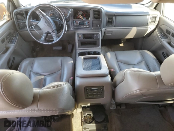 2005 GMC Yukon SLE with VIN 1GKEC13T15J230550, listed as a Copart auction lot 77214624 with 203,095 mi miles and Salvage Title. Bid and sale history available at carsss.com. Image 8.