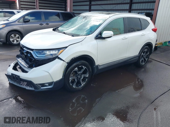 2018 Honda CR-V Touring with VIN 2HKRW1H96JH506435, listed as a IAAI auction lot 41228873 with 11,585 mi miles and . Bid and sale history available at DreamBid. Image 18.