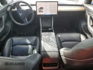 2020 Tesla Model 3 Standard Range Plus with VIN 5YJ3E1EA4LF799597, listed as a Copart auction lot 76401374 with 77,506 mi miles and Salvage Title. Bid and sale history available at DreamBid. Image 8.