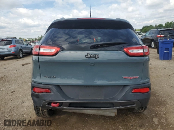 2015 Jeep Cherokee Trailhawk with VIN 1C4PJMBB1FW630715, listed as a Copart auction lot 58559675 with 58,302 mi miles and Salvage title. Bid and sale history available at DreamBid. Image 6.