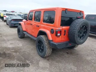 2020 Jeep Wrangler Unlimited Sahara with VIN 1C4HJXENXLW231194, listed as a IAAI auction lot 42083147 with 34,166 mi miles. Bid and sale history available at carsss.com. Image 3.