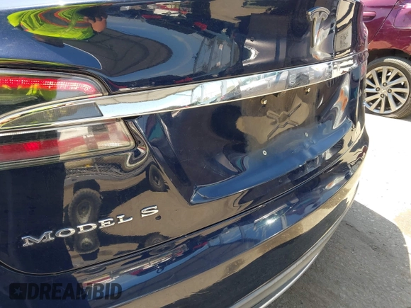 2013 Tesla Model S with VIN 5YJSA1DN1DFP05317, listed as a IAAI auction lot 42086998 with 150,964 mi miles. Bid and sale history available at carsss.com. Image 13.