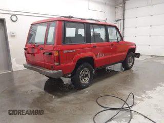 1991 Isuzu Trooper z VIN JACCH58R6M8905869, wystawiony jako IAAI lot #42394651 z przebiegiem 117 130 mil mil oraz . Historia ofert i sprzedaży dostępna na DreamBid. Obrazek 4.