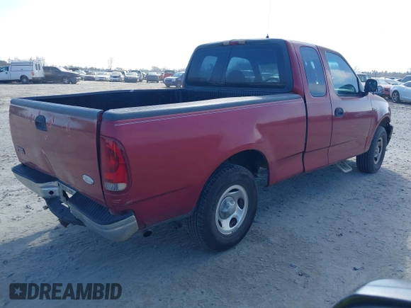 2000 Ford F-150 XL with VIN 1FTZX1729YNC32076, listed as a IAAI auction lot 41523364 with 216,726 mi miles. Bid and sale history available at carsss.com. Image 4.
