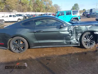 2016 Ford Mustang EcoBoost z VIN 1FA6P8TH1G5290015, wystawiony jako IAAI lot #41011870 z przebiegiem 97 547 mil mil oraz . Historia ofert i sprzedaży dostępna na DreamBid. Obrazek 13.