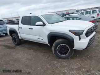 2024 Toyota Tacoma 4WD SR5 with VIN 3TMLB5JN2RM001031, listed as a IAAI auction lot 41743995 with 15,009 mi miles. Bid and sale history available at carsss.com. Image 1.