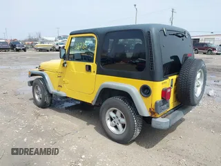 2000 Jeep Wrangler Sport with VIN 1J4FA49S2YP768451, listed as a IAAI auction lot 42136785 with 74,492 mi miles. Bid and sale history available at carsss.com. Image 3.