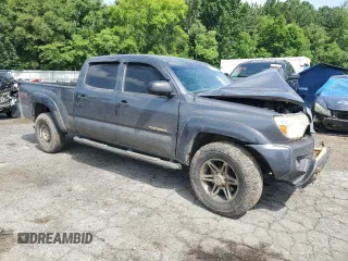 2014 Toyota Tacoma with VIN 5TFMU4FN3EX025697, listed as a Copart auction lot 62146895 with 133,028 mi miles and Salvage title. Bid and sale history available at DreamBid. Image 4.