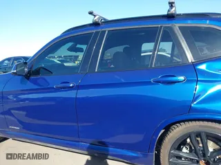 2015 BMW X1 xDrive28i with VIN WBAVL1C56FVY32753, listed as a IAAI auction lot 41759454 with 130,823 mi miles. Bid and sale history available at carsss.com. Image 14.
